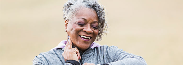Woman checking her pulse.